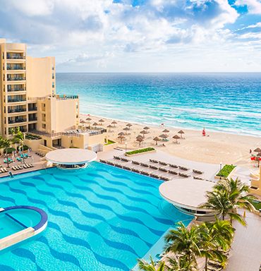 Infinity pool overlooking a Mexican Caribbean beach